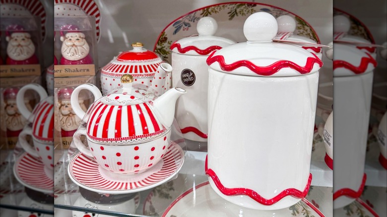 Red and white striped and dotted teapot and cookie jar on a HomeGoods shelf