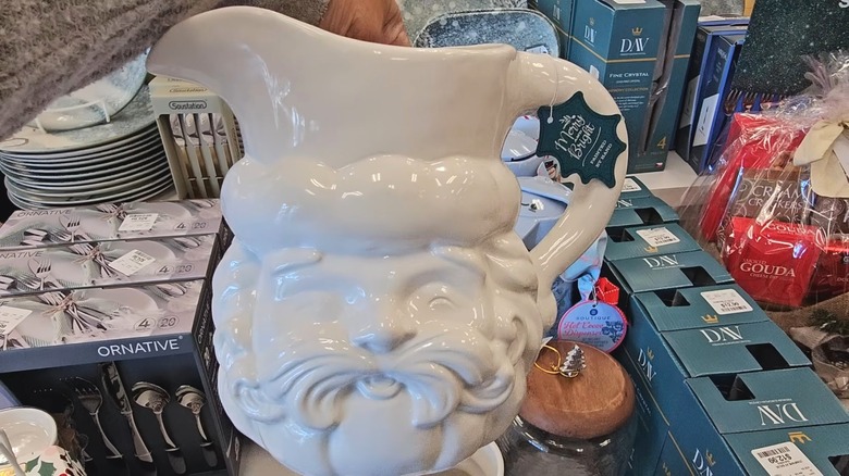 Person holding up the Merry and Bright Santa Pitcher