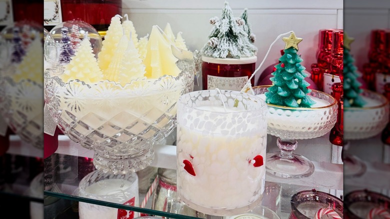HomeGoods shelf with a variety of winter-themed candles