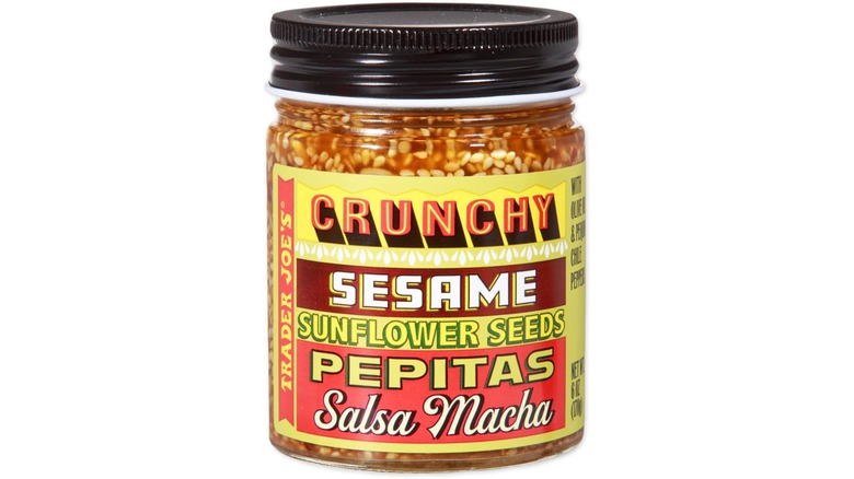 Jar of Trader Joe's Crunchy Sesame Sunflower Seeds Pepitas Salsa Macha against white background.