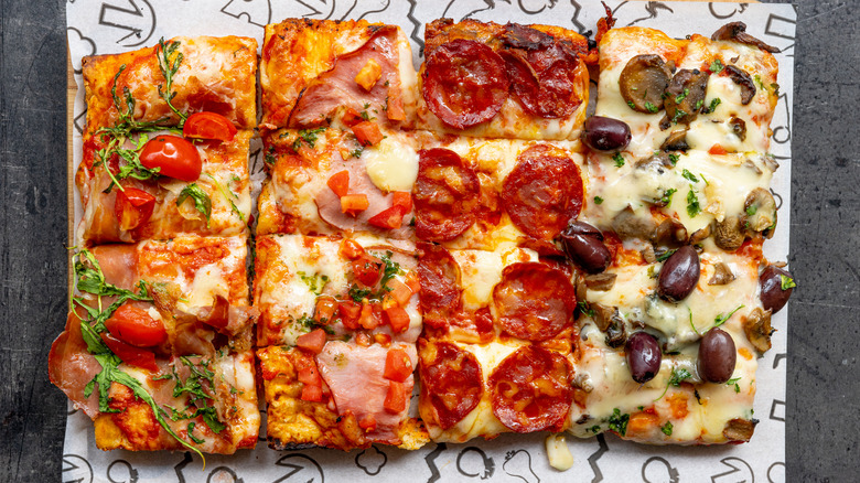 Rectangular pizza with assorted toppings.