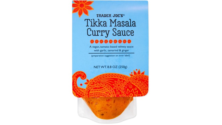 Package of Trader Joe's Tikka Masala Curry Sauce against white background.