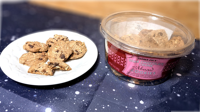 Chocolate chunk cookies on plate next to product package