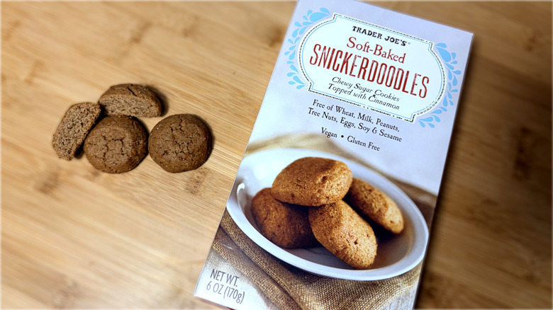 Snickerdoodle cookies on cutting board next to product box