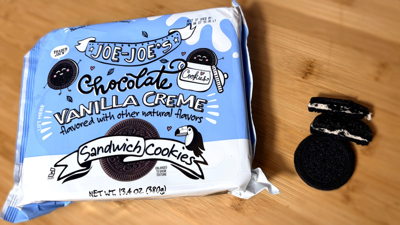 Sandwich cookies on cutting board next to product package