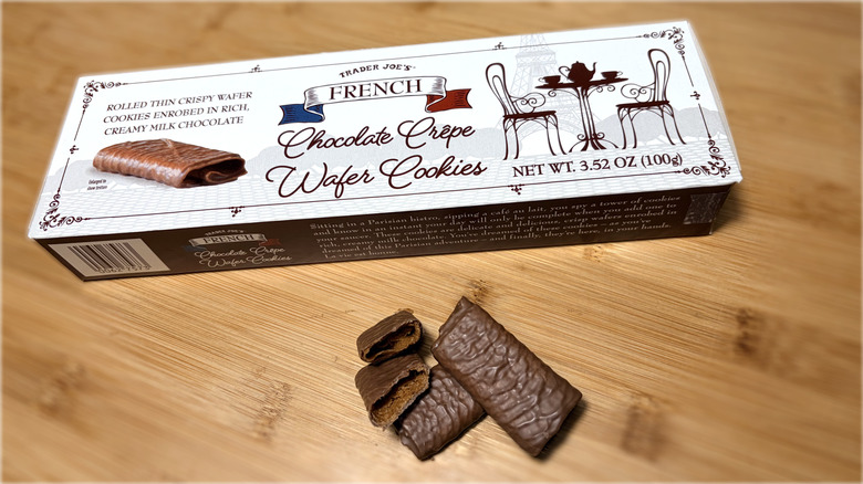 Chocolate crepe wafer cookies on cutting board next to product box