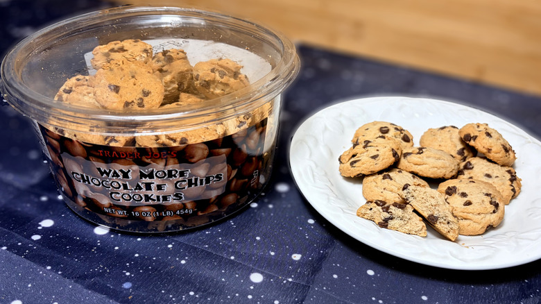 small chocolate chip cookies on plate next to product package