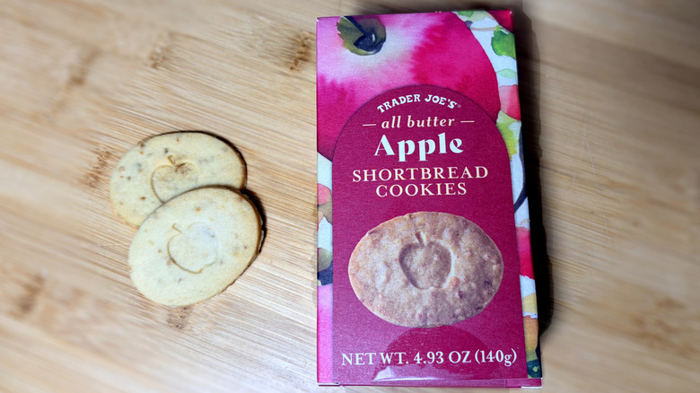 Apple shortbread cookies on cutting board next to product box