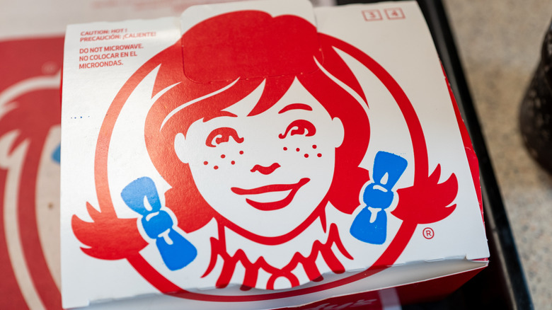 Wendy's logo on a cardboard box on a table
