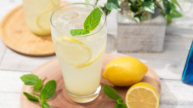 Homemade lemonade with lemon, ice, and mint