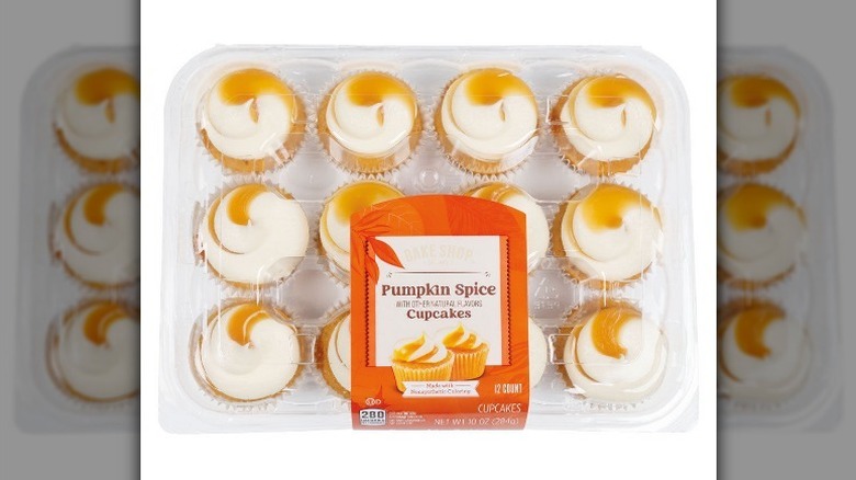 Mini pumpkin cupcakes on white background