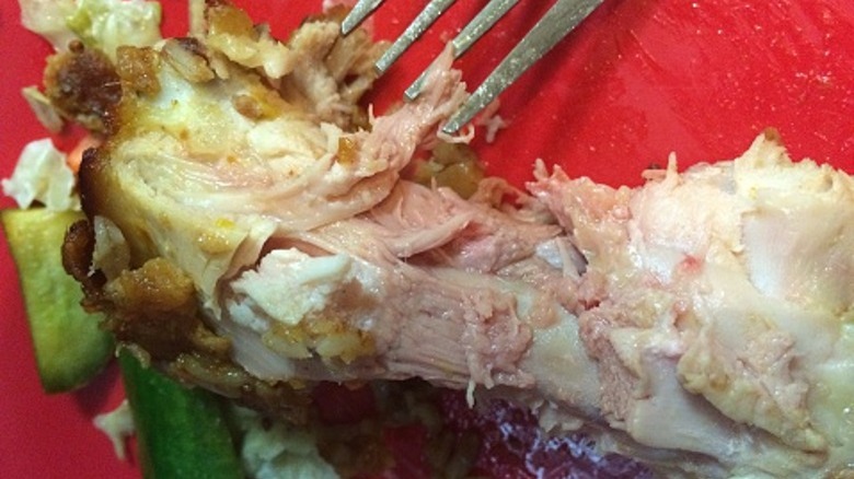 undercooked chicken on bone