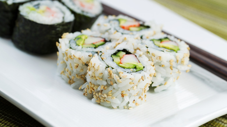 Close up photo of california rolls on a plate