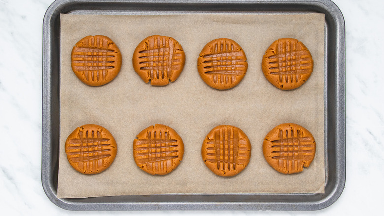 unbaked cookies on baking sheet