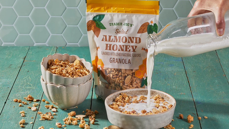 Salted almond honey granola in bowls with milk