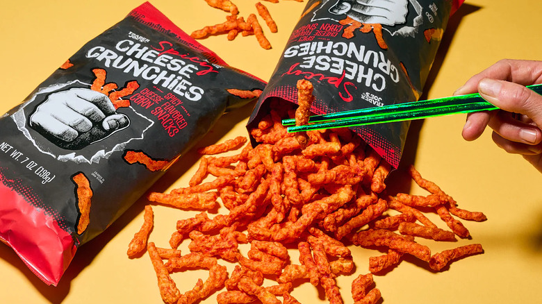 Spicy cheese crunchies coming out of bag