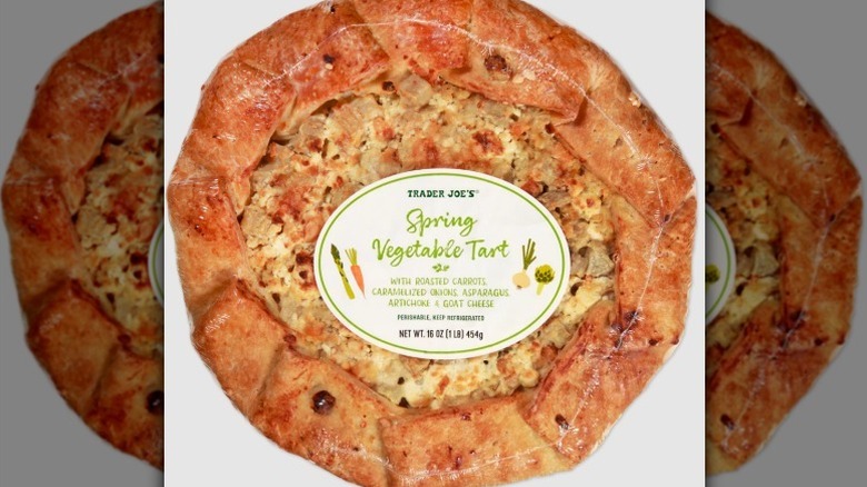 Spring vegetable tart on white background