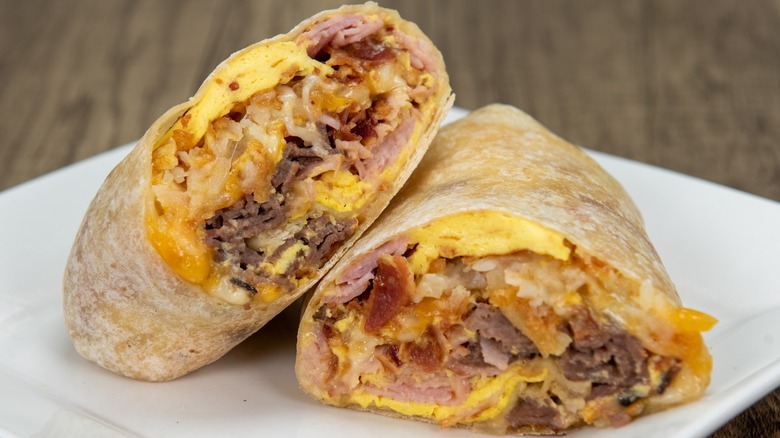 breakfast burrito halves on a plate