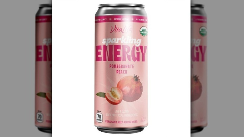 Pomegranate peach sparkling energy drink on white background