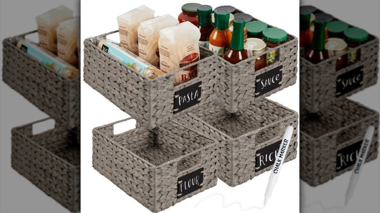 Labeled baskets with kitchen supplies against white background.