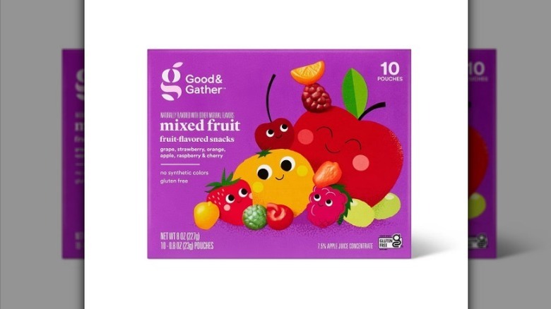 Mixed fruit snacks in purple box on white background
