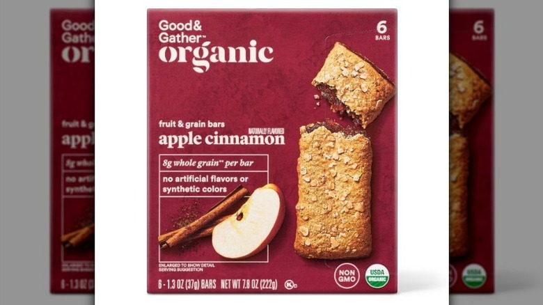 Apple cinnamon bars in a maroon box on white background