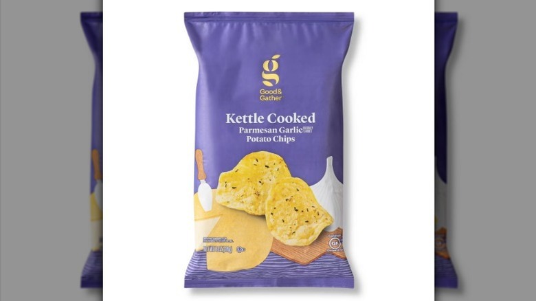 Parmesan garlic chips in a purple bag on white background