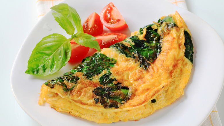 Omelet with tomato on plate