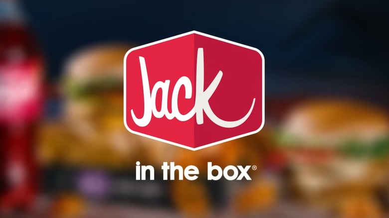 Jack in the Box logo on blurred background of menu items