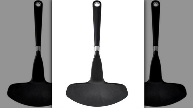 Extra wide turner in black on white background