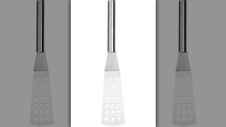 Metal angled turner on white background