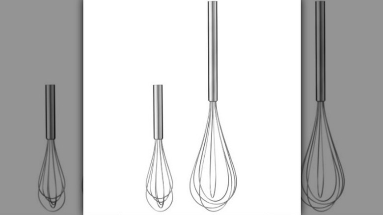Two-piece metal whisk set on white background