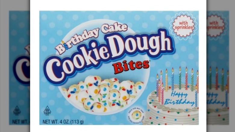 Birthday cake cookie dough bites with baby blue label on white background
