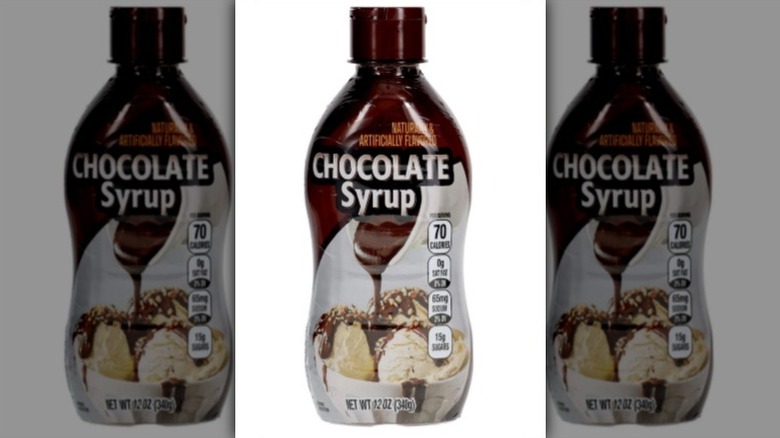 Chocolate syrup with an image of chocolate syrup being poured on vanilla ice cream on white background