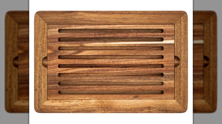 A wooden Crofton board on a white background