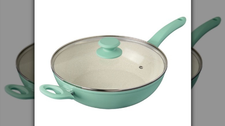 Ceramic saute pan with lid on white background