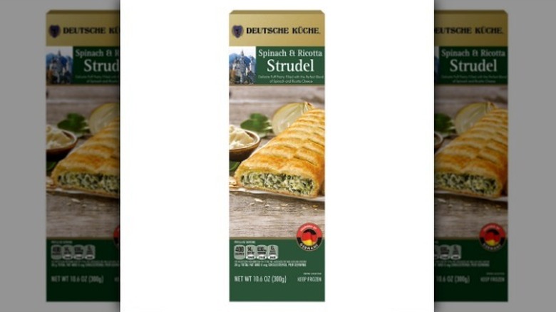Spinach ricotta strudel on white background
