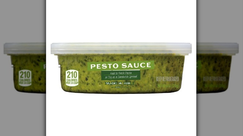 Pesto sauce jar on white background