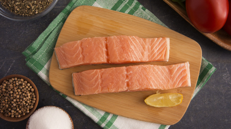 Salmon filets on cutting board