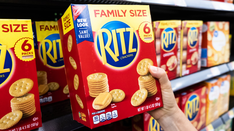 Hand holding Ritz crackers box