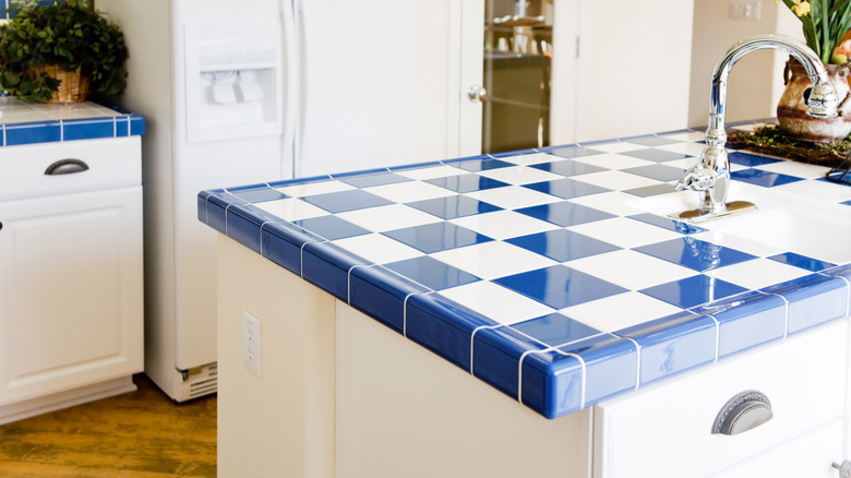 Kitchen with blue and white checkered tile countertops