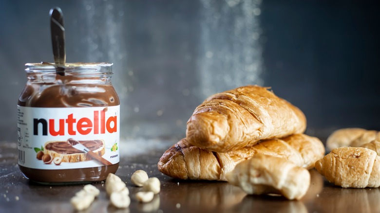 nutella alongside croissants and hazelnuts
