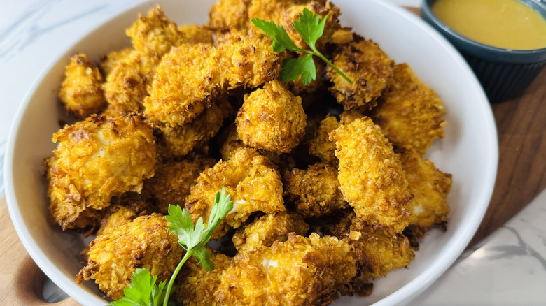 Popcorn chicken served with dipping sauce