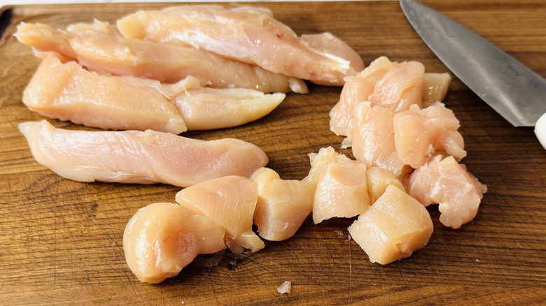 Cutting chicken into pieces