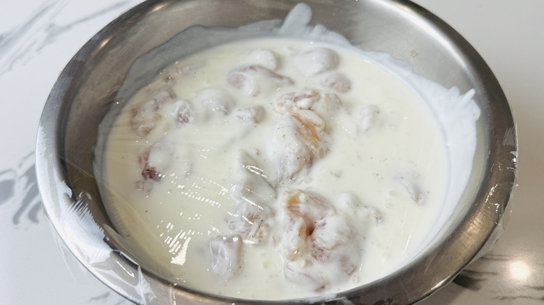 Buttermilk coated in chicken in bowl