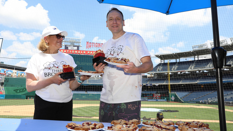 Joey Chestnut holding food