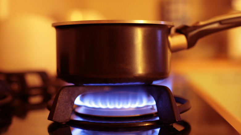 saucepan over gas burner