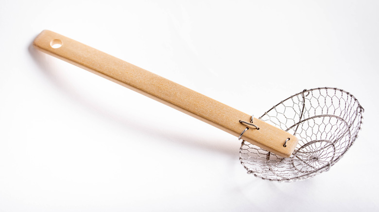 spider straining utensil