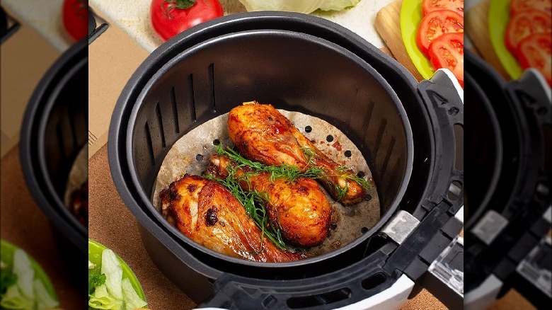 cooking chicken over parchment paper