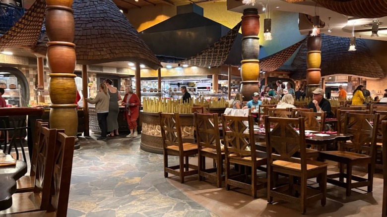 Diners lining up to take food from the buffet at Boma Flavors of Africa in Animal Kingdom